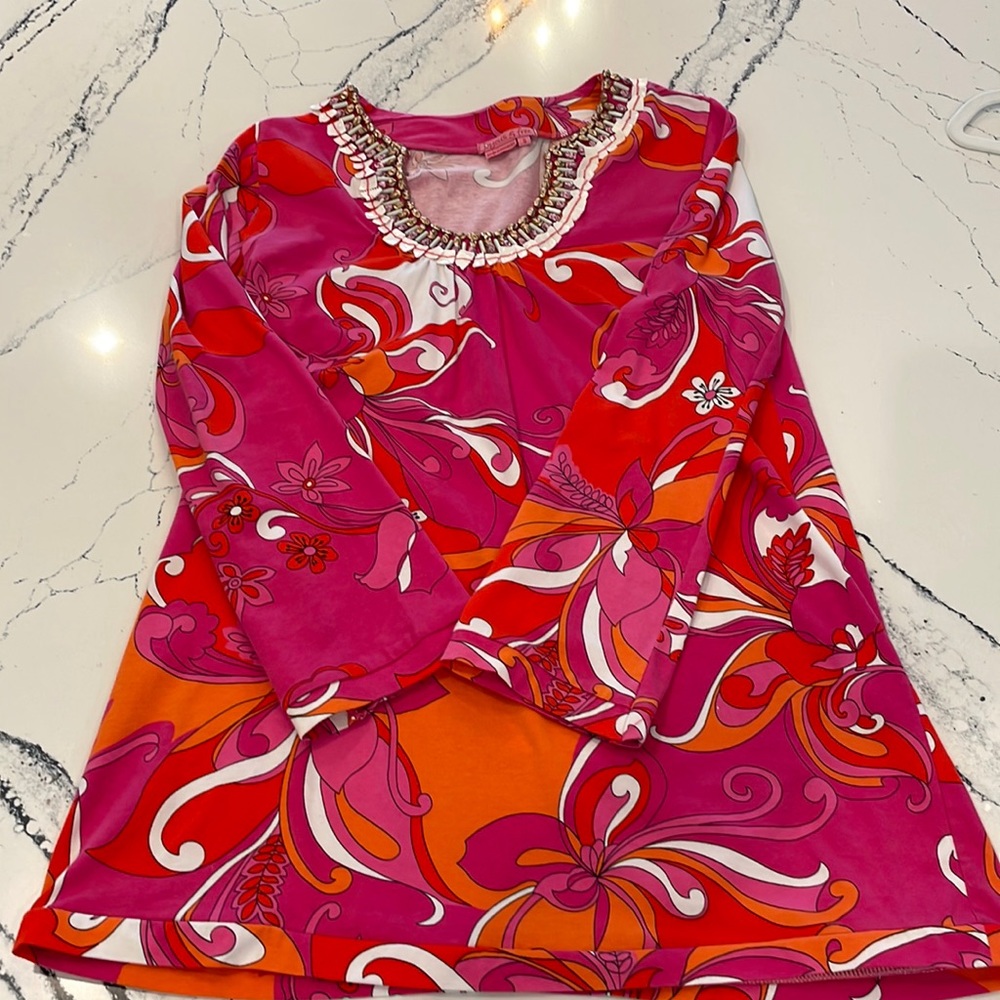 Colorful tunic length top with neckline embellishment, size small